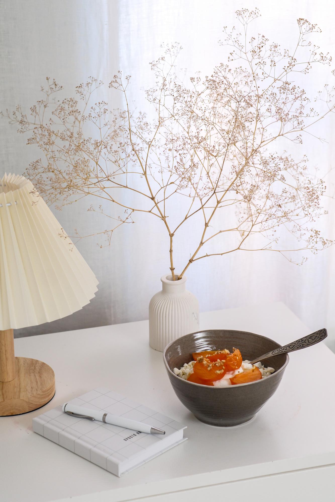 Cozy studio corner with cookbook and plates